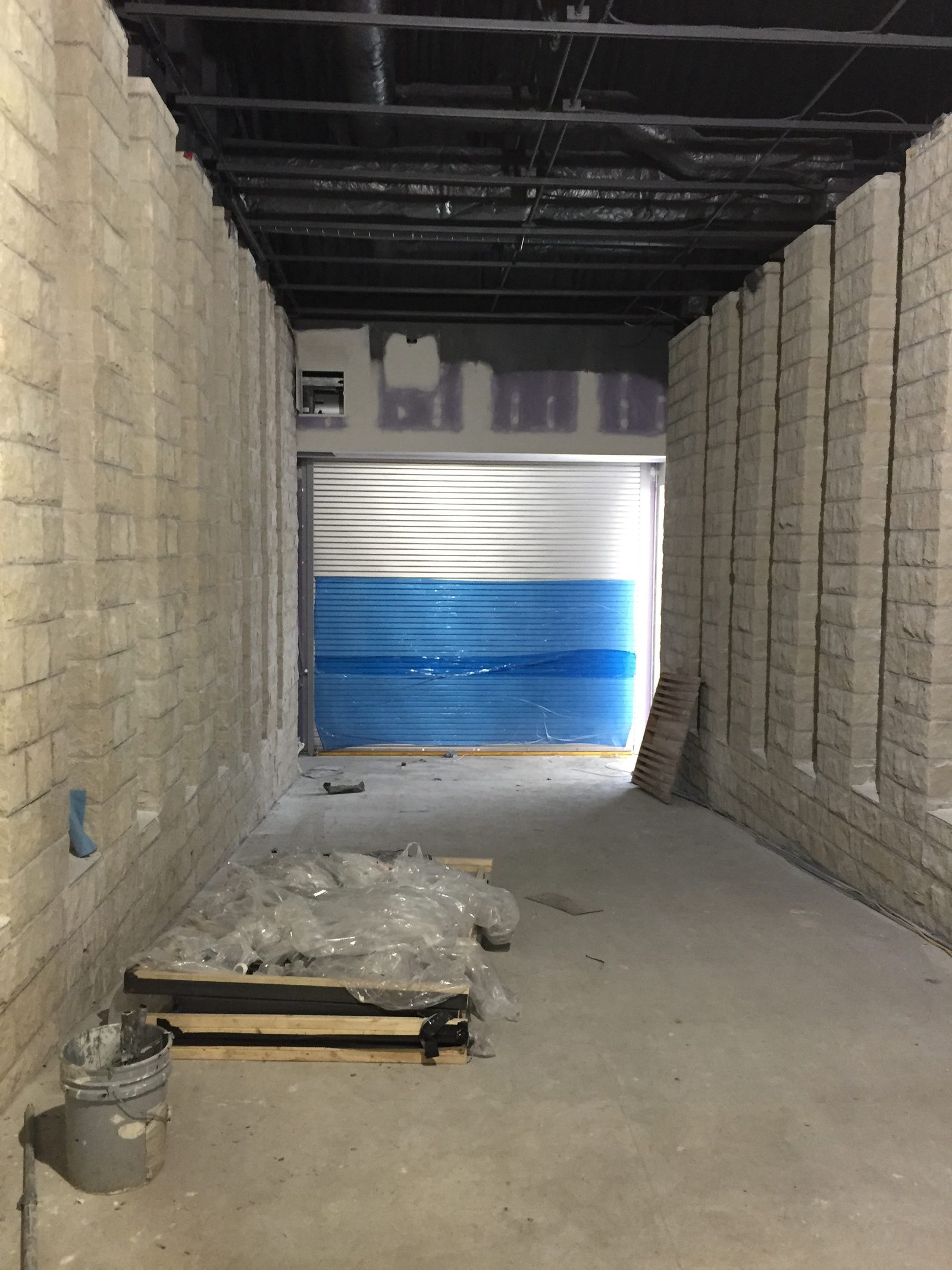 Masonry corridor and overhead door